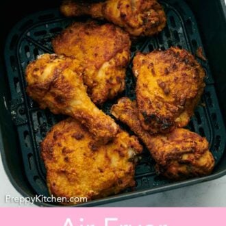 Pinterest graphic of overhead view of air fryer fried chicken in an air fryer basket.