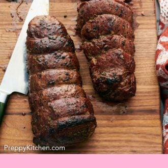 Pinterest graphic of an overhead view of a wooden cutting board with beef tenderloin in the process of being cut.