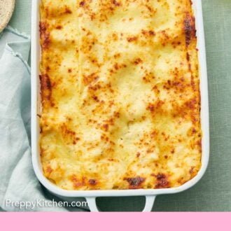 Pinterest graphic of an overhead view of a baking dish of chicken lasagna.