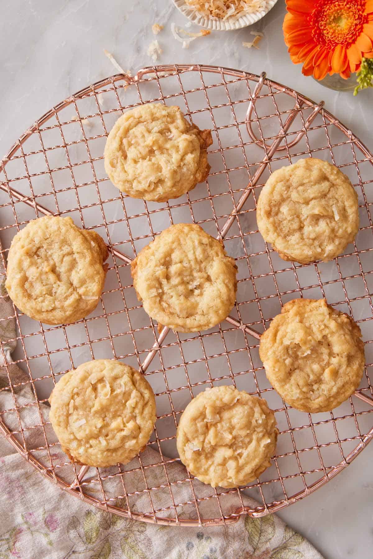 Overhead view of a round cooling rack with coconut cookies.