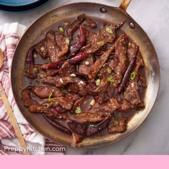 Pinterest graphic of a skillet of Mongolian beef.