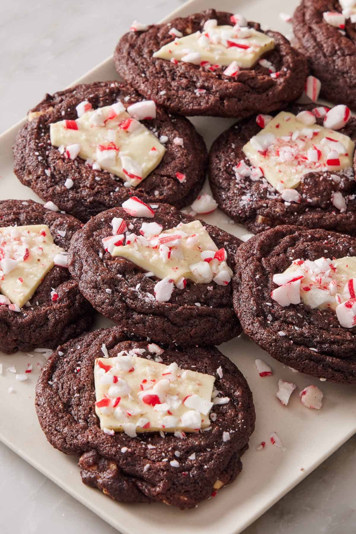 Cookies with peppermint bark in the center topped with crushed candy canes.