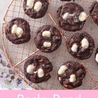 Pinterest graphic of an overhead view of a cooling rack with rocky road cookies.