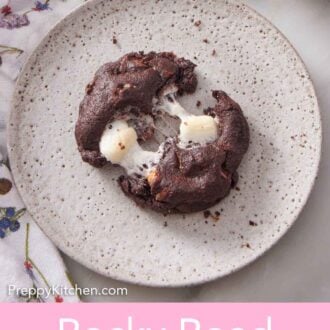 Pinterest graphic of a plate with a rocky road cookie torn apart.