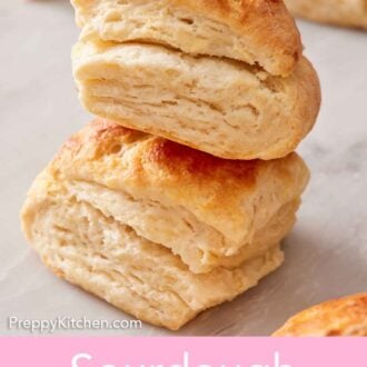 Pinterest graphic of two sourdough biscuits stacked on top of each other.