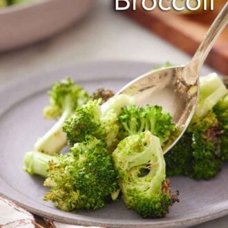 Pinterest graphic of a spoonful of air fryer broccoli spooned on a plate.