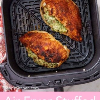 Pinterest graphic of two air fryer stuffed chicken breasts in an air fryer basket.