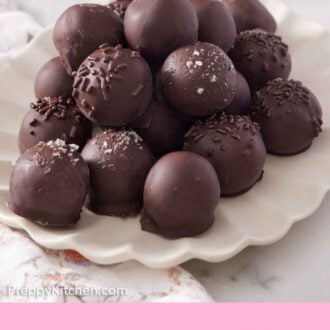 Pinterest graphic of a scalloped platter of brownie truffles.