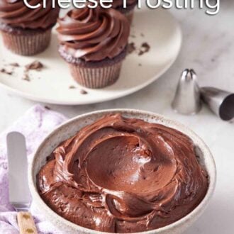 Pinterest graphic of a bowl of chocolate cream cheese frosting with three frosted cupcakes in the background.