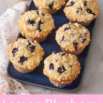 Pinterest graphic of lemon blueberry muffins on a blue platter, topped with crumb topping.