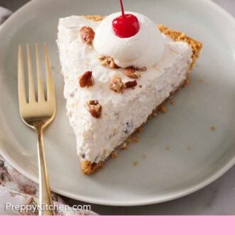 Pinterest graphic of a plate with a slice of Millionaire Pie with a dollop of whipped cream with a maraschino cherry on top with a fork beside it.