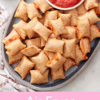 Pinterest graphic of a platter of air fryer pizza rolls with a bowl of marinara sauce.