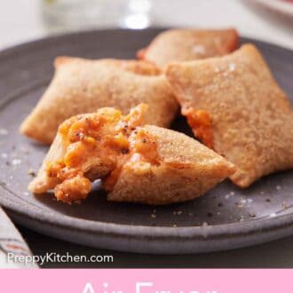 Pinterest graphic of an air fryer pizza roll cut open on a plate with more in the background.