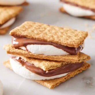 A stack of two air fryer s'mores with more in the background.