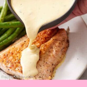 Pinterest graphic of a bowl of béarnaise sauce poured over salmon on a plate.