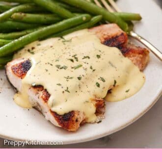 Pinterest graphic of béarnaise sauce on top of salmon on a plate with green beans.