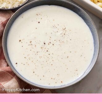 Pinterest graphic of a bowl of béchamel sauce with pepper on top.