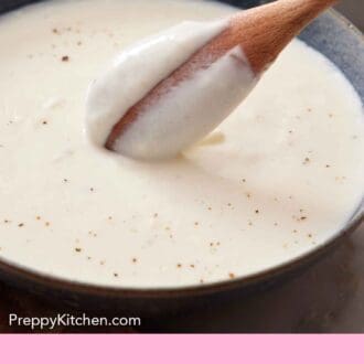 Pinterest graphic of a back of a spoon showing the texture of béchamel sauce.