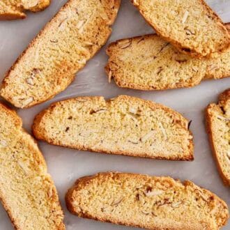 Overhead view of multiple biscotti on a marble surface.