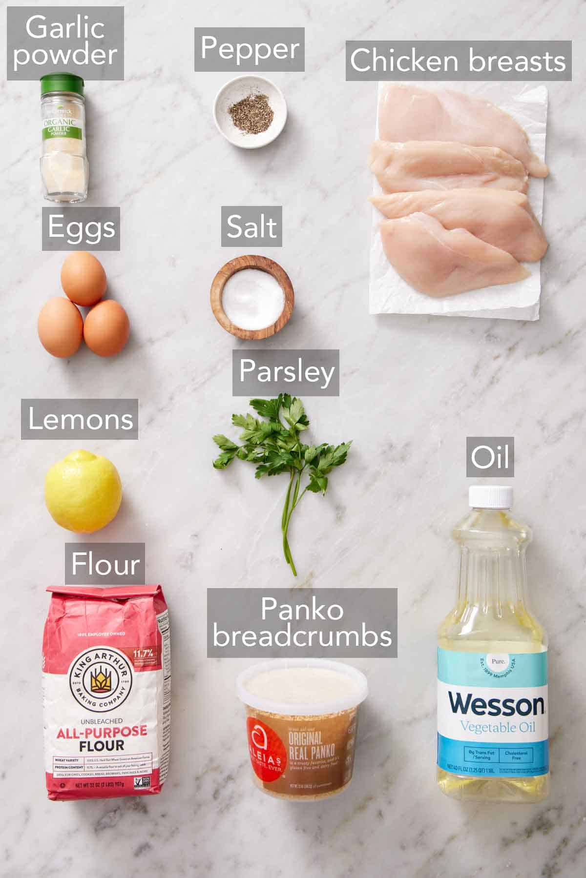 Ingredients needed to make chicken schnitzels.