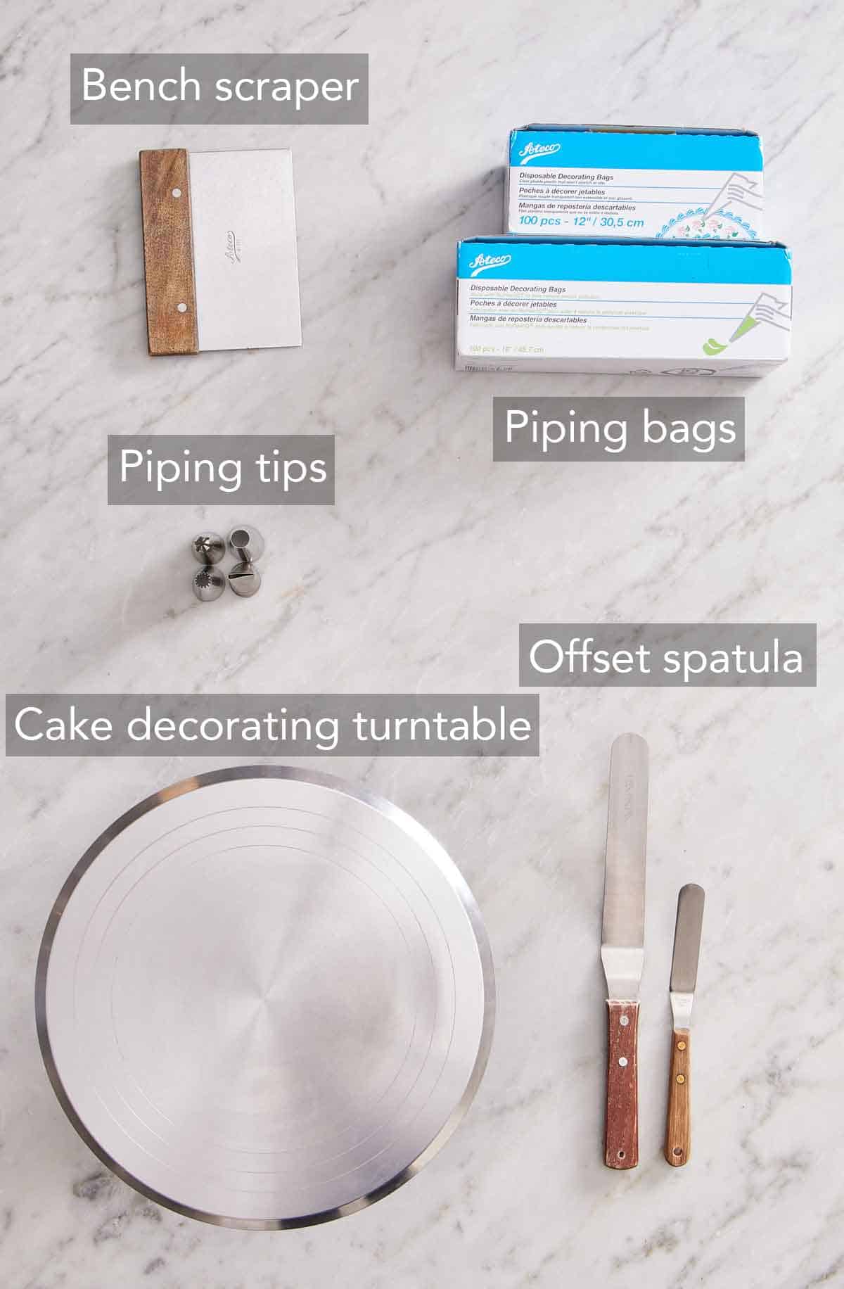 Flat lay of tools needed to decorate a cake.