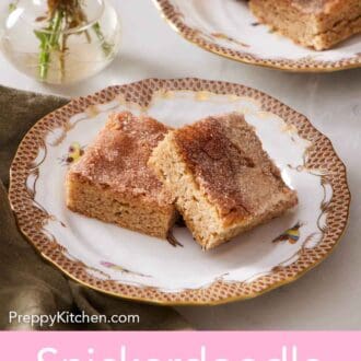 Pinterest graphic of a plate with two pieces of snickerdoodle bars. A second plate in the back.