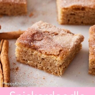 Pinterest graphic of a snickerdoodle bars on a marble surface.