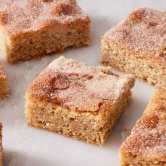 Snickerdoodle bars on a marble surface in a single layer.