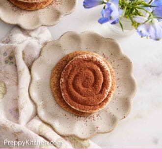 Pinterest graphic of an overhead view of two tiramisu cookies on individual plates.