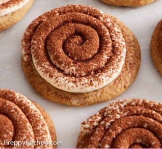 Pinterest graphic of tiramisu cookies in a single layer on a marble surface.