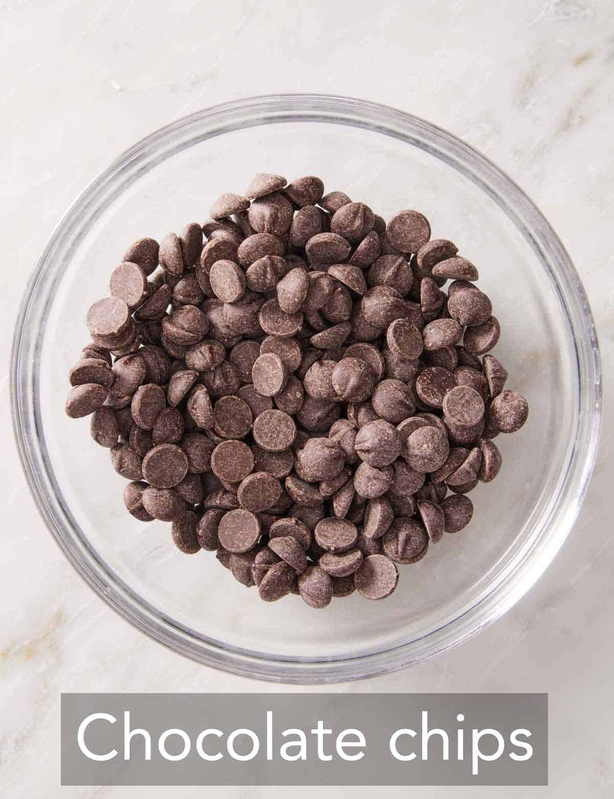 An overhead view of a bowl of chocolate chips.