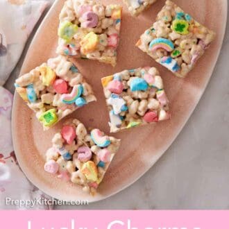 Pinterest graphic of an overhead view of six pieces of Lucky Charms treats on an oval platter.