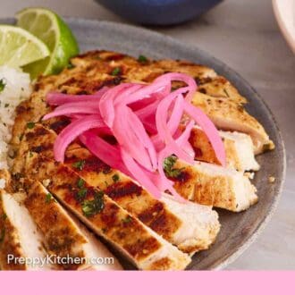 Pinterest graphic of pickled onions on top of sliced chicken on a plate.