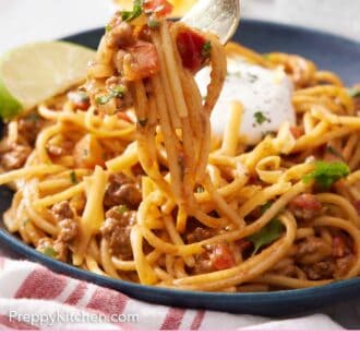 Pinterest graphic of a fork lifting up some taco spaghetti from a bowl.