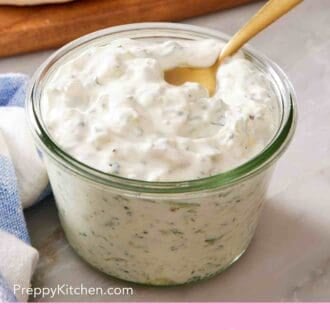 Pinterest graphic showing a glass jar of homemade tzatziki.