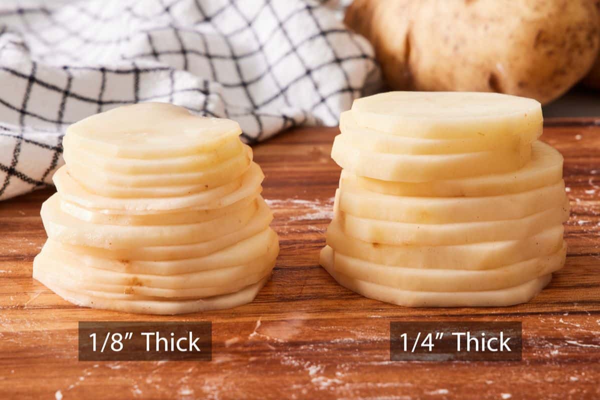 Comparison image showing stacks of sliced potatoes at ¼-inch and 1⁄8-inch thick on a wooden cutting board.