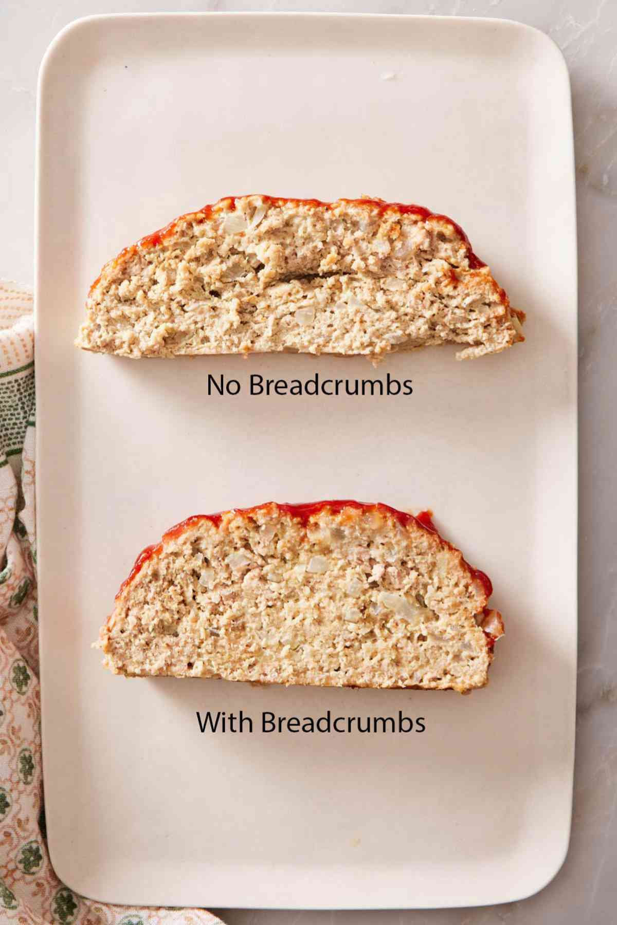 Two slices of turkey meatloaf on a platter: one made with breadcrumbs and one made without.