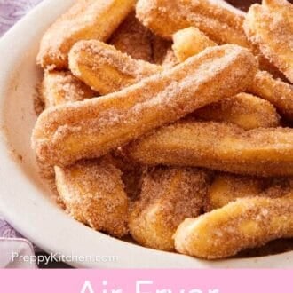 Pinterest graphic showing a close-up of a platter of air fryer churros.