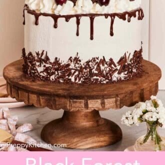 Pinterest graphic showing a whole black forest cake on a cake stand with decorative items around it.