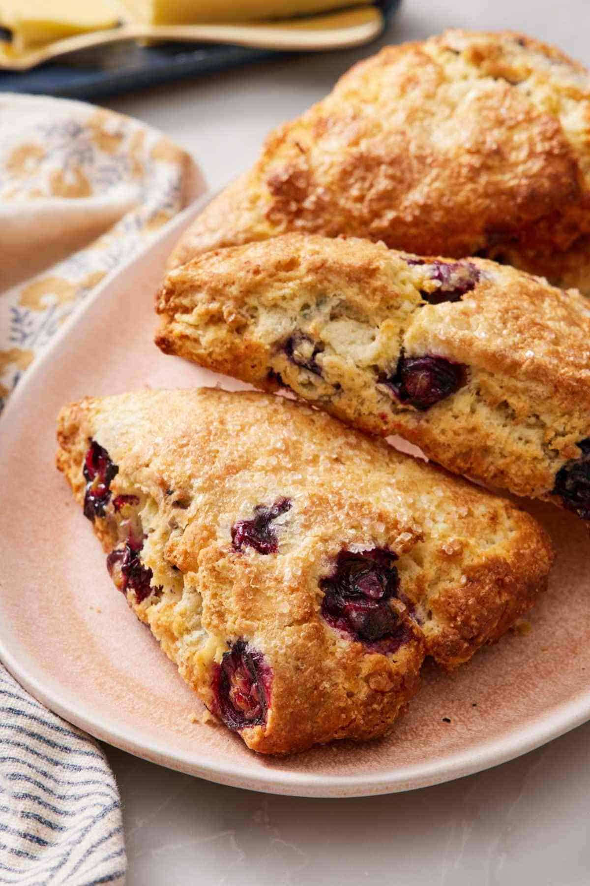 Air fryer blueberry scones on a platter.
