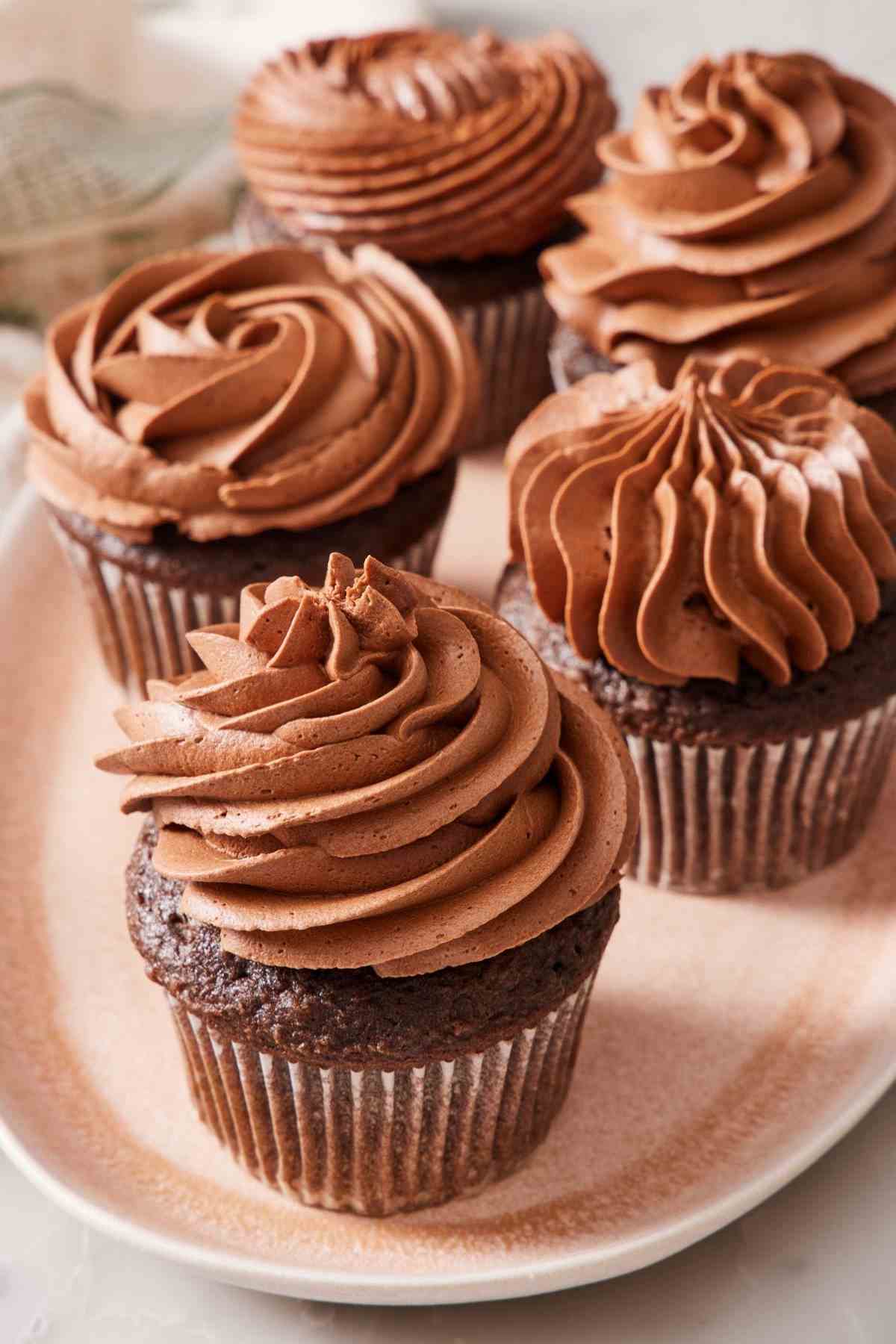 Chocolate cupcakes frosted with whipped ganache.