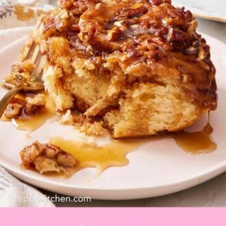 Pinterest graphic of a close-up of a sticky bun on a small plate.