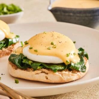 Eggs Florentine on a plate with a fork.