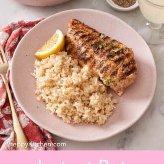 Pinterest graphic of a plate with Instant Pot brown rice with chicken and a lemon wedge.