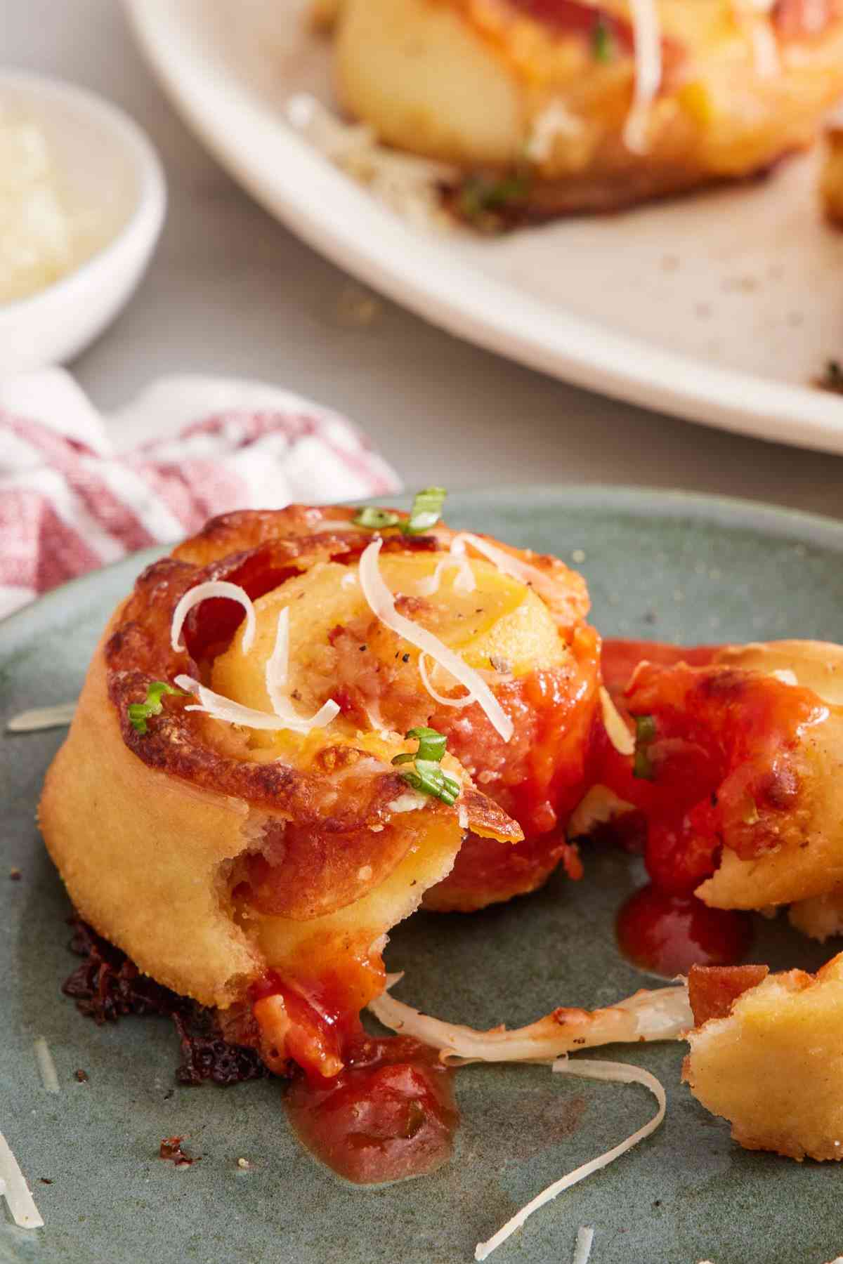 Close-up of a pizza roll torn in half.