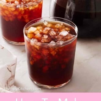 Pinterest graphic showing two glasses of cold brew over ice, with a pitcher with more coffee alongside.