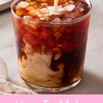 Pinterest graphic showing milk pored into a glass of cold brew coffee over ice.