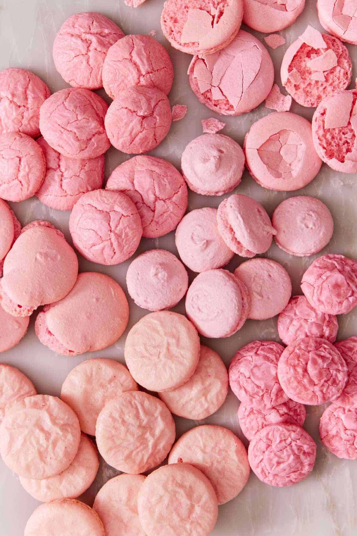 Overhead view of several incorrect macaron recipe results.