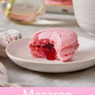 Pinterest graphic showing a macaron on a plate with a jam filling oozing out.