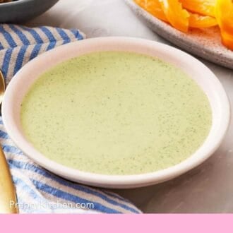 Pinterest graphic showing green tahini sauce.